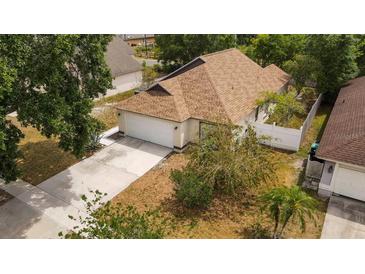 Charming home with a well-maintained lawn and a two-car garage at 11113 Sylvan Pond Cir, Orlando, FL 32825