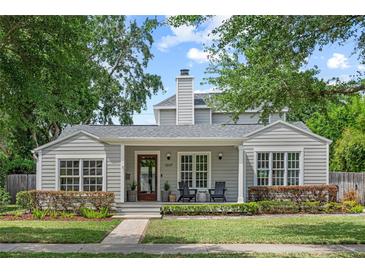 Charming single-Gathering home showcasing a landscaped front yard, covered porch, and craftsman architecture at 1207 W New Hampshire St, Orlando, FL 32804