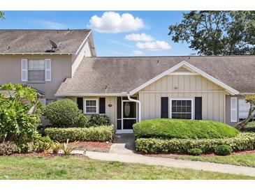 Charming home with well-manicured landscaping, a cozy entrance, and a neutral color palette at 1136 Villa Ln # 96, Apopka, FL 32712