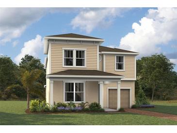 Charming two-story home featuring manicured lawn, lush plantings and neutral color palette at 2332 Salty Winds Way, Kissimmee, FL 34747