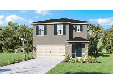 Inviting two-story home features a two car garage, stone accents, and a well manicured front yard at 4622 Barberry Ave, Lakeland, FL 33811