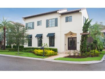 Stunning two-story home featuring elegant architecture, manicured landscaping, and a welcoming entrance at 9730 Lounsberry Cir, Golden Oak, FL 32836