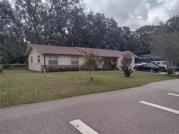 Charming single story home with mature landscaping and neutral paint scheme at 123 N High St, Lake Mary, FL 32746