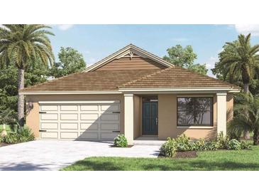 Charming single-story home featuring a two-car garage, well-manicured lawn, and tropical landscaping at 4493 Yaupon Holly Way, Lakeland, FL 33811