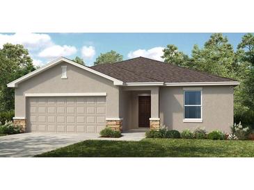 Charming single-story home with a two-car garage and stone accents for added curb appeal at 4760 Yellow Elder Way, Kissimmee, FL 34758