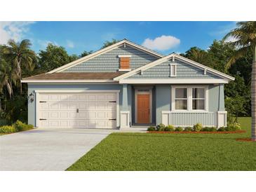 Charming single-story home with a two-car garage, light blue siding, and a well-manicured front lawn at 5420 Cloudberry Ave, Lakeland, FL 33811