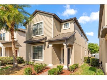 Charming two-story home with manicured landscaping and a welcoming front entrance at 7349 Ella Ln, Windermere, FL 34786