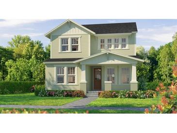 Charming two-story home with a well-manicured lawn and beautiful landscaping at 10043 Dulbecco St, Orlando, FL 32827