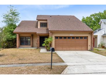 Charming home featuring a two-car garage, well-maintained landscaping and neutral stucco exterior at 1103 Saddleback Ridge Rd, Apopka, FL 32703