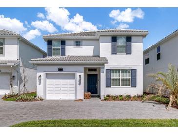 Charming two-story home with a well-maintained front yard and a private, one-car garage at 4772 Kings Castle Cir, Kissimmee, FL 34746