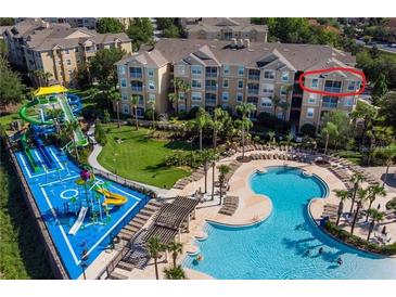 Resort-style community with a pool, water slides, and lush landscaping, offering a luxurious living experience at 7650 Comrow St # 403, Kissimmee, FL 34747