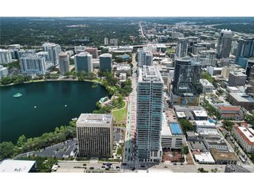 An amazing aerial view of downtown Orlando, a lake and the city skyline at 150 E Robinson St # 717, Orlando, FL 32801