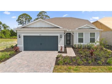Charming single-Gathering home with a brick paved driveway and well-maintained landscaping at 8105 Fenton St, Orlando, FL 32836