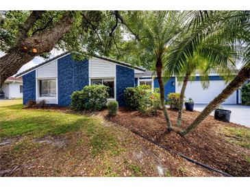 Charming single-story home with well-maintained landscaping and mature trees at 10108 Matchlock Dr, Orlando, FL 32821