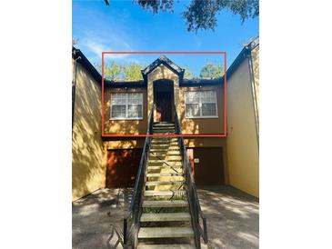 Charming townhome featuring a private entrance and convenient garage access at 6328 Raleigh St # 816, Orlando, FL 32835