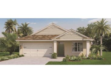 Charming one-story home featuring a two-car garage, neutral exterior, and well-manicured landscaping at 211 Taylor Groves Dr, Lake Wales, FL 33853