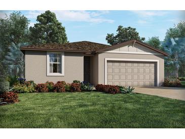Charming single-story home featuring a lush front yard and a two-car garage at 2365 White Tail St, Davenport, FL 33837