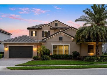 Beautiful two-story home with a tile roof, well-maintained landscaping, and an attached two-car garage at 3647 Farm Bell Pl, Lake Mary, FL 32746