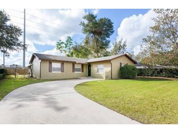 Charming single-story home with a well-maintained front yard and a long, curved driveway at 631 Trailwood Dr, Altamonte Springs, FL 32714