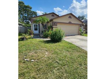 Charming single-Gathering home with a well-manicured lawn and inviting curb appeal at 6434 Tidewave St, Orlando, FL 32822