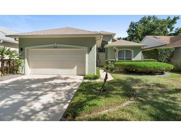 Charming single-story home featuring a well-manicured lawn and attached two-car garage at 829 Lakeworth Cir, Lake Mary, FL 32746