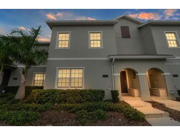 Well-maintained two-story home featuring manicured landscaping and an inviting entryway at 4983 Windermere Ave, Kissimmee, FL 34746