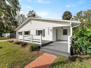 Charming single-story home with a welcoming front porch and well-maintained landscaping at 2205 Pine Island Dr, New Smyrna Beach, FL 32168