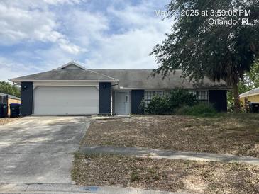 Charming single-story home featuring an attached garage and a cozy front yard in a suburban setting at 7614 Brisbane Ct, Orlando, FL 32835