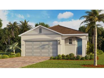 Charming single-story home with a blue front door, paver driveway and lush landscaping at 3973 Kennebunk Loop, Mount Dora, FL 32757