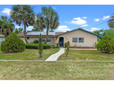 Charming single-story home with well-manicured lawn, desert landscaping, and inviting entrance at 820 Hobson St, Longwood, FL 32750