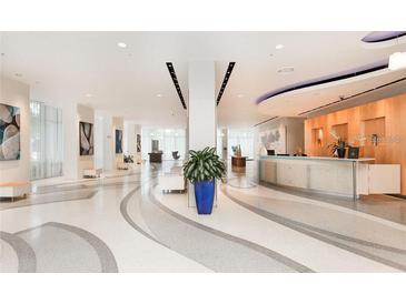 Bright, modern lobby with sleek design, reception desk, and comfortable seating areas for a grand entry at 150 E Robinson St # 2002, Orlando, FL 32801