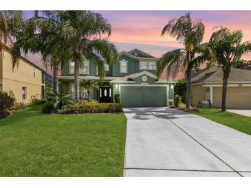 Charming two-story home boasts lush landscaping, a two-car garage, and a welcoming front entrance at 2842 Balforn Tower, Winter Garden, FL 34787