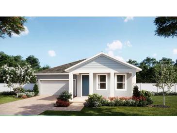Charming single-story home featuring well-manicured landscaping and a two-car garage at 4619 Laurel Site Loop, Apopka, FL 32712
