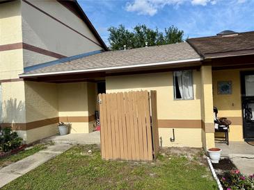Charming townhouse features a fenced front yard and freshly painted exterior at 963 Stucki Ter, Winter Garden, FL 34787