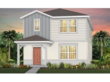Charming two-story home with gray and white exterior and well-manicured lawn, complemented by lush tropical landscaping at 3363 Vine Leaf St, Apopka, FL 32712
