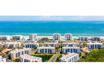 Aerial view of beachfront condo buildings and the expansive oceanfront at 5300 S Atlantic Ave # 6-502, New Smyrna Beach, FL 32169