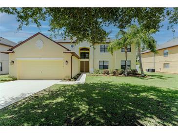 Charming two-story home featuring mature trees, lush lawn and a two car garage at 1778 Waterside Oaks Dr, Orange City, FL 32763