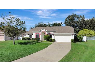 Charming single-Gathering home with well-manicured lawn and attached two-car garage at 2019 Wintermere Pointe Dr, Winter Garden, FL 34787