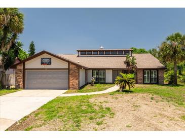 Charming single-Gathering home featuring a two-car garage and well-maintained front yard in a sunny neighborhood at 140 Margate Mews, Longwood, FL 32779