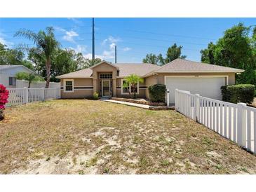 Charming home featuring a well-maintained lawn and a welcoming front entrance at 2074 S Parkton Dr, Deltona, FL 32725