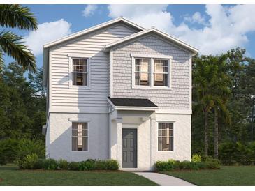 Charming two-story home featuring white siding and a welcoming front porch at 550 Orient Ave, Debary, FL 32713