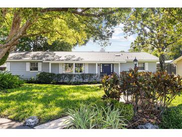 Charming single-story home with a well-manicured lawn and inviting landscaping at 803 Arlington Blvd, Altamonte Springs, FL 32701