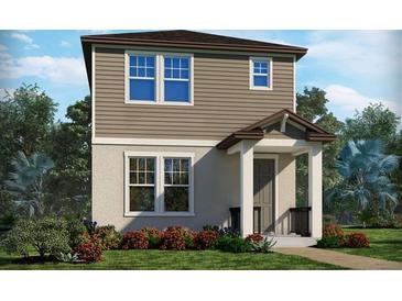 Charming two-story home featuring neutral siding, a welcoming porch, and beautifully landscaped front yard at 16460 Silver Brook Way, Winter Garden, FL 34787
