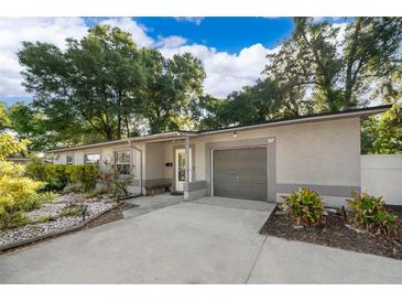 Charming single-story home with a well-maintained front yard and attached garage at 3049 Condel Drive, Orlando, FL 32812