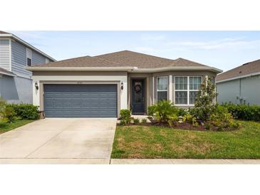 Charming single-story home with a well-maintained lawn, a two-car garage, and lovely curb appeal at 2723 Forestdale St, St Cloud, FL 34771