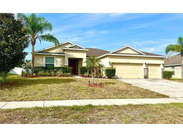 Well-maintained single Gathering home with manicured landscaping and a three car garage at 1062 Rock Creek St, Apopka, FL 32712
