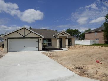 New construction with modern neutral color palette and two-car garage at 16648 Sw 25Th Ct, Ocala, FL 34473
