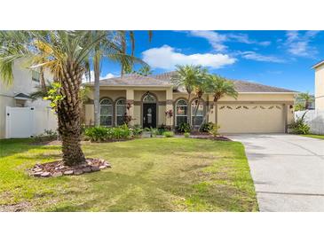 Charming single-story home with well-maintained landscaping and a two-car garage at 1319 Castleport Rd, Winter Garden, FL 34787
