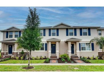 Charming townhomes with manicured lawns and tasteful landscaping create welcoming curb appeal at 1562 Dalehurst Ln, Kissimmee, FL 34744