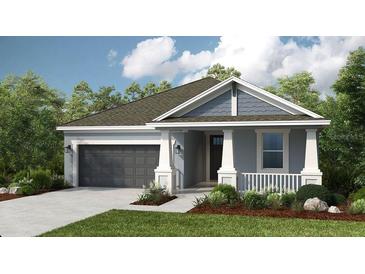 Charming single-story home featuring a two-car garage and a beautifully landscaped front yard at 4704 Coral Harbour Rd, Kissimmee, FL 34758